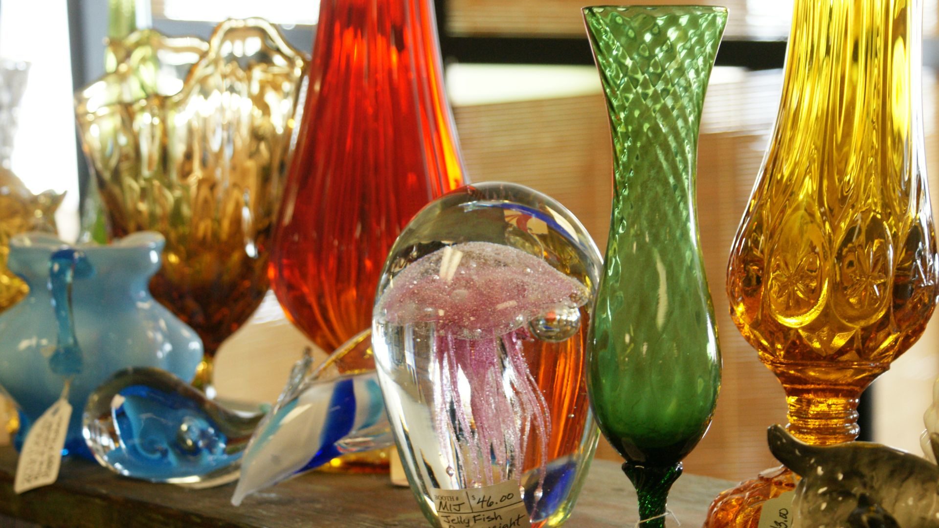 Various pieces of colorful antique glassware.