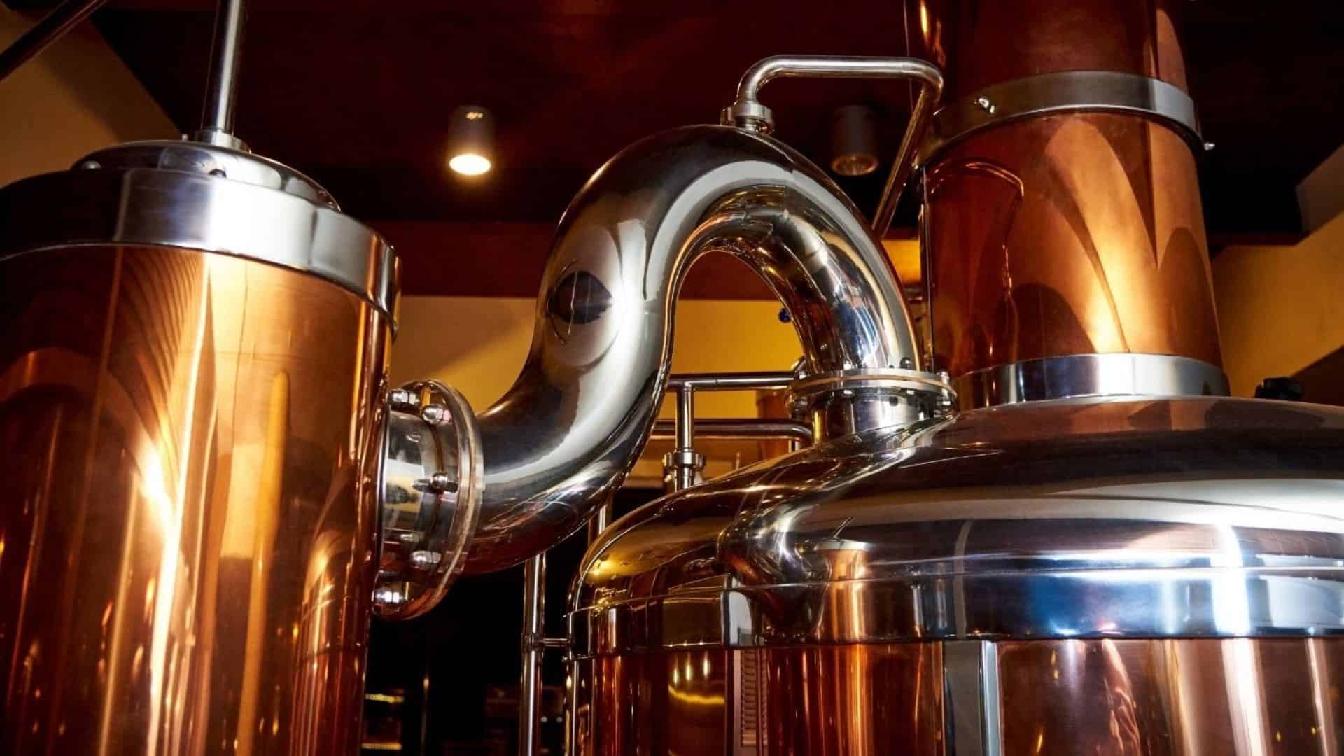 A distillery with gleaming copper equipment