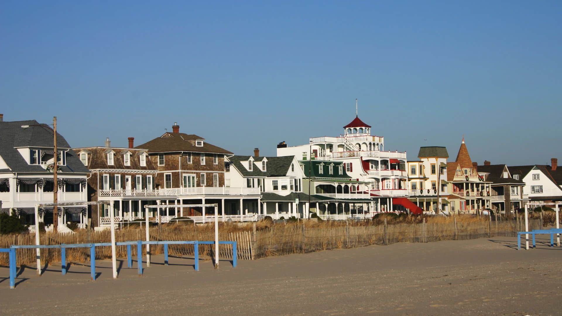 view of cape may beachfront with victorian homes in background