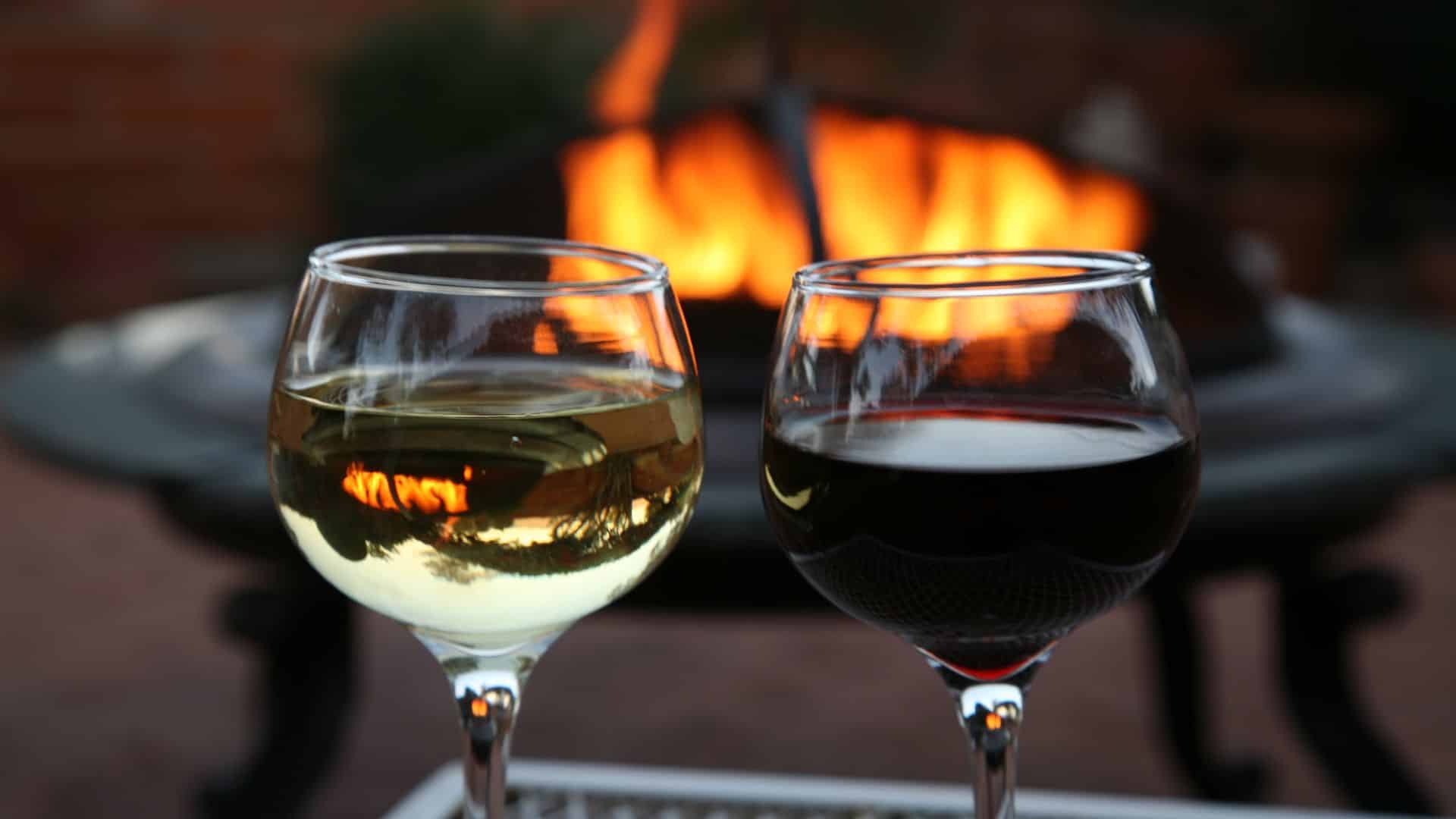 outdoor firepit with two glasses of wine