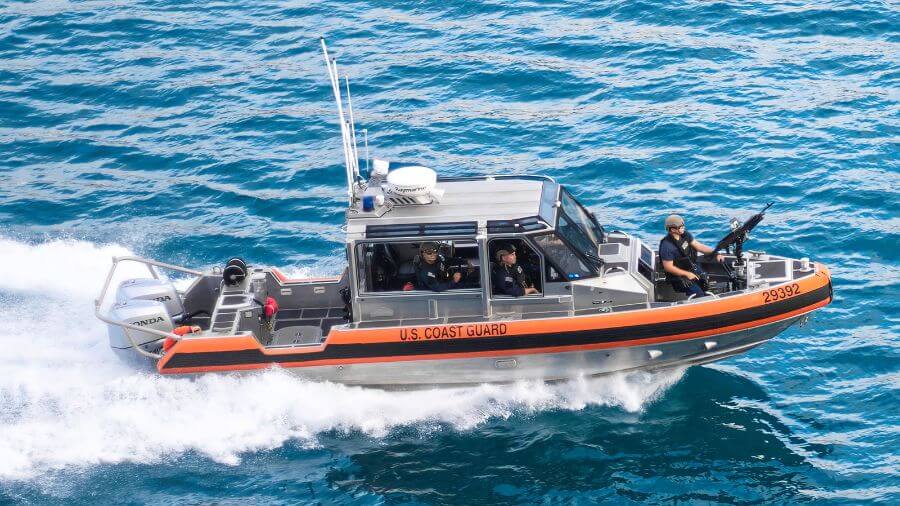 US Coast Guard patrol boat and crew speeding across open water, a nod to the Coast Guard legacy of Cape May NJ.