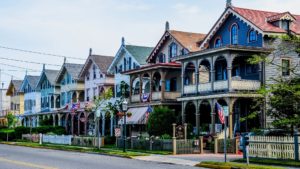 a row of late Victorian homes painted in multi-colors 