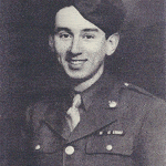 A black and white photo of a smiling soldier from Normandy