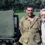 Two veterans near a Jeep