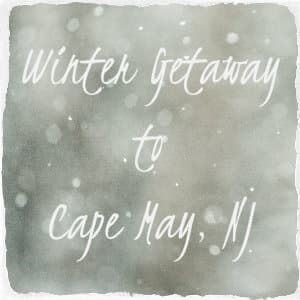 Soft grey background with specks of white dots and text overlay Winter Getaway to Cape May, NJ