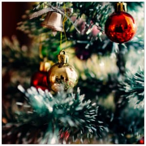Evergreen branches and ornaments - Photo by Rodion Kutsaev on www.unsplash.com